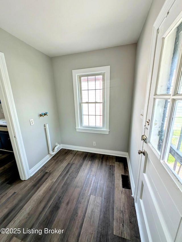 1104 Oleanda Ave, Louisville, KY 40215 - unfurnished room with dark wood-type flooring, healthy amount of natural light, and baseboards