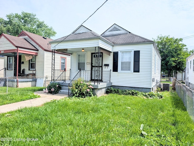 1104 Oleanda Ave, Louisville, KY 40215 - shotgun-style home featuring covered porch, central AC unit, and a shingled roof