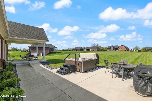 view of patio featuring outdoor dining area, a hot tub, and a residential view
