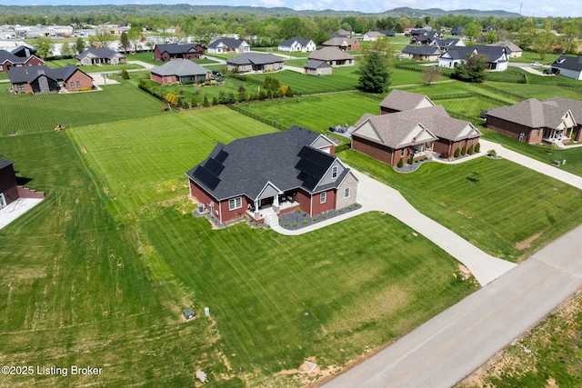 birds eye view of property with a residential view