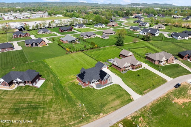 aerial view with a mountain view and a residential view