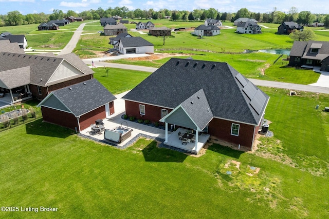 bird's eye view with a water view and a residential view