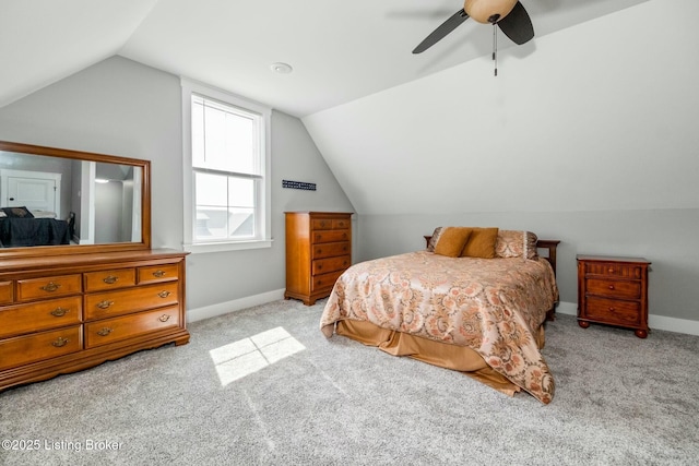 bedroom featuring baseboards, vaulted ceiling, ceiling fan, and carpet