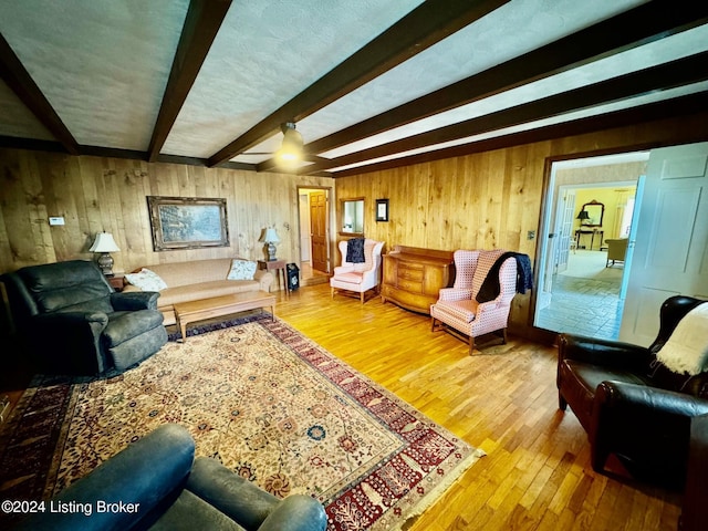 608 Lincoln Park Rd, Springfield, KY 40069 - living room with wooden walls, wood finished floors, and beamed ceiling