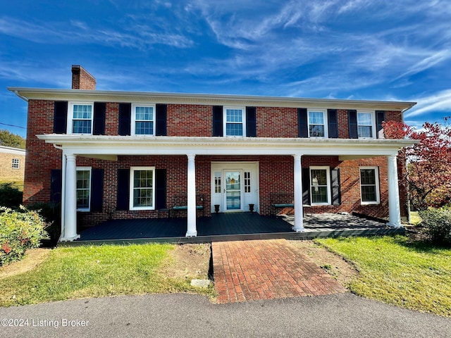 608 Lincoln Park Rd, Springfield, KY 40069 - traditional home with brick siding, a porch, and a chimney