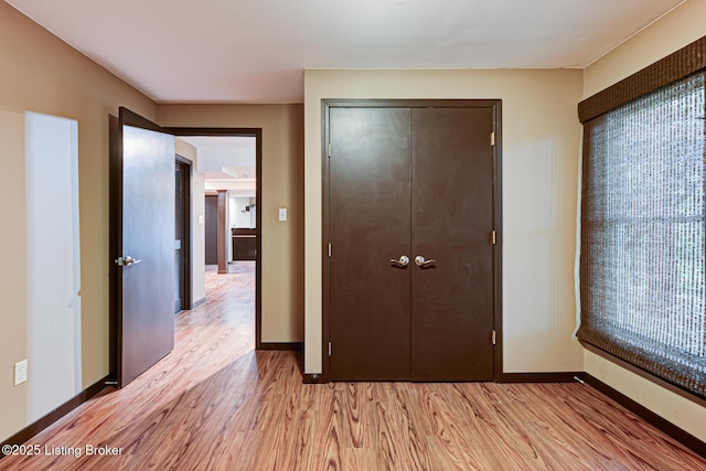 5204 Saratoga View Pl, Louisville, KY 40299 - unfurnished bedroom with light wood-style floors, a closet, and baseboards