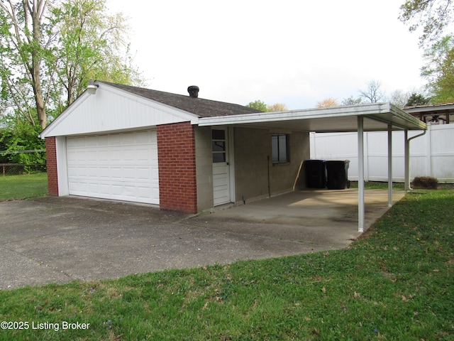 garage featuring a garage and fence