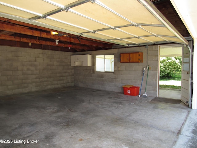 garage with concrete block wall