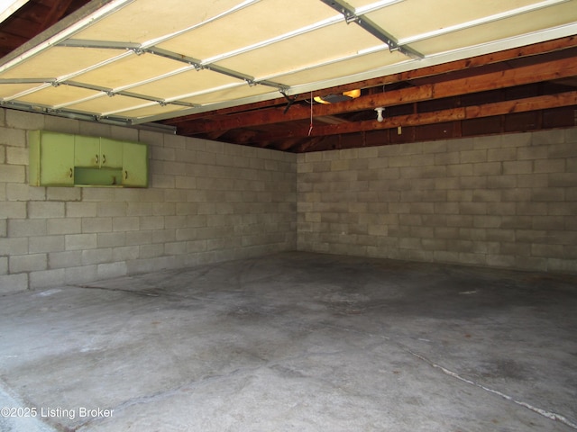 garage with concrete block wall