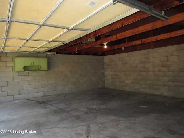 garage with concrete block wall