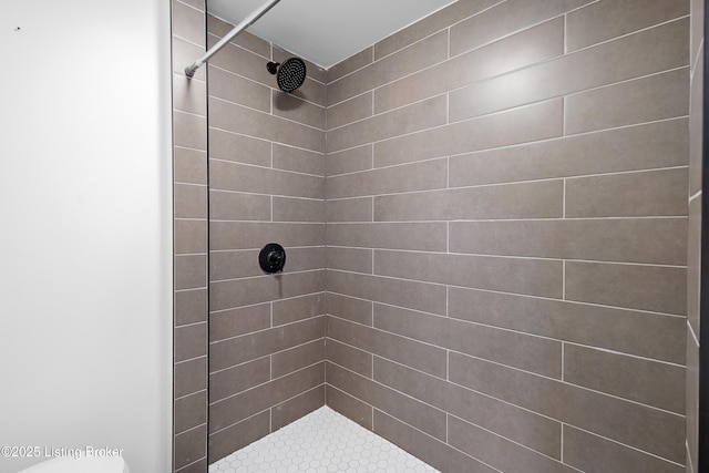 bathroom with a tile shower