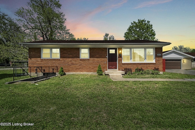 ranch-style house with brick siding, a front lawn, fence, and a garage
