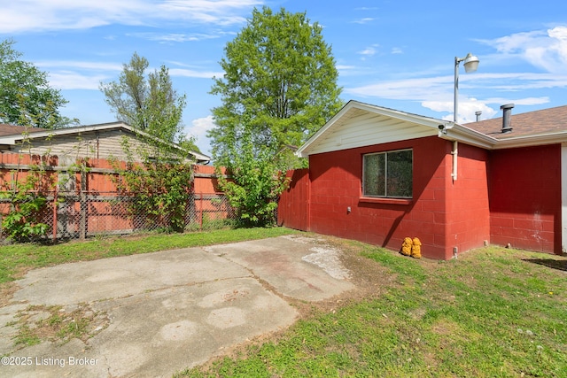 view of patio / terrace featuring fence
