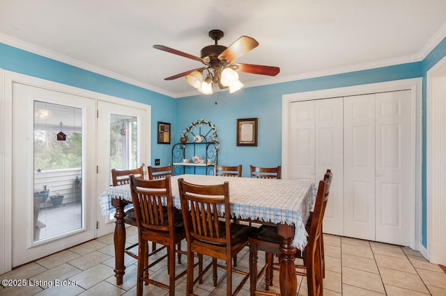 dining area featuring a ceiling fan, ornamental molding, and light tile patterned flooring