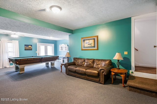 playroom featuring carpet floors, a textured ceiling, and pool table