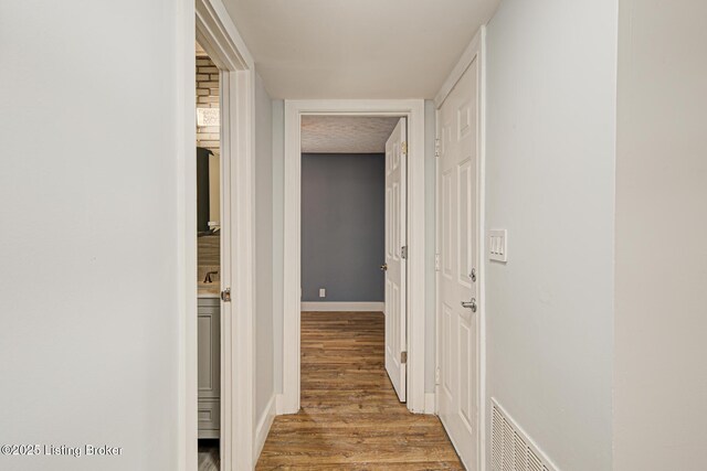 9003 Holly Village Ct, Lyndon, KY 40242 - hall featuring visible vents, baseboards, and wood finished floors