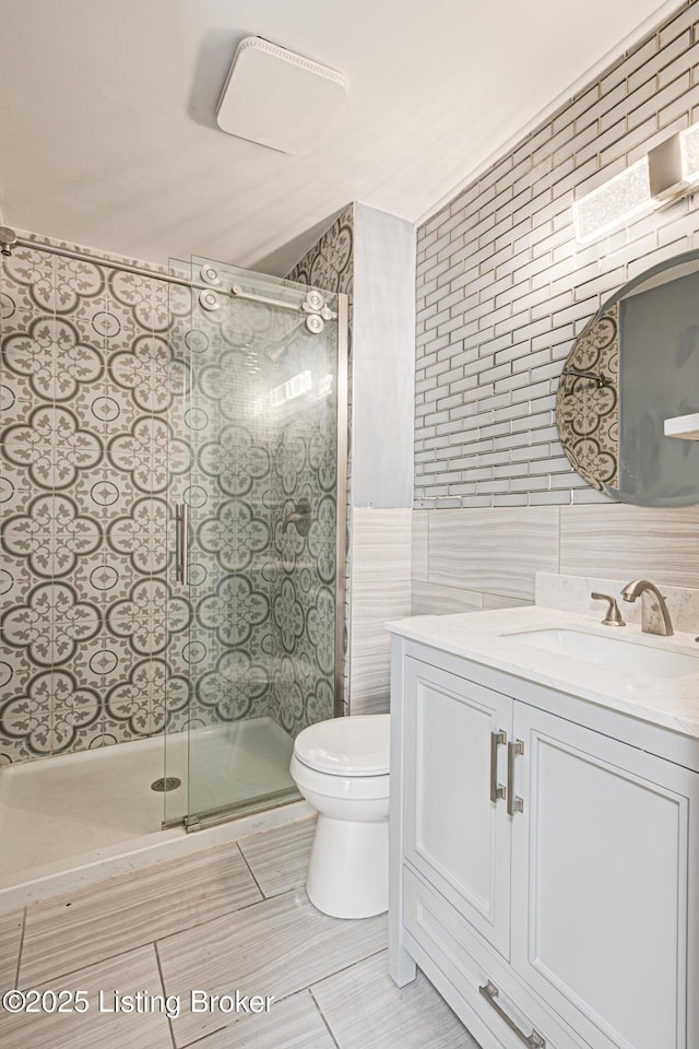 9003 Holly Village Ct, Lyndon, KY 40242 - full bath with tile walls, vanity, toilet, and a stall shower