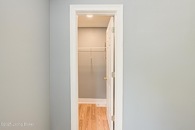 9003 Holly Village Ct, Lyndon, KY 40242 - hallway featuring light wood finished floors and visible vents