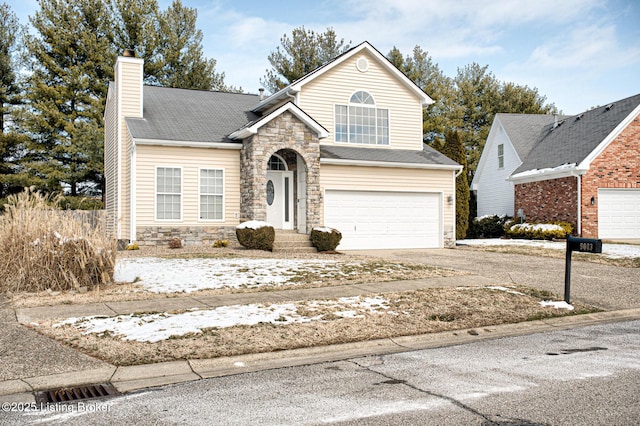 9003 Holly Village Ct, Lyndon, KY 40242 - traditional-style home featuring stone siding, an attached garage, driveway, and a chimney