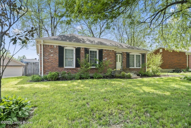 view of front of house with fence, brick siding, and a front lawn