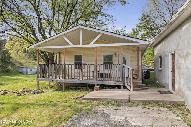 1782 Happy Hollow Rd, Clermont, KY 40110 - view of front of house featuring a front lawn, a deck, a patio, and cooling unit