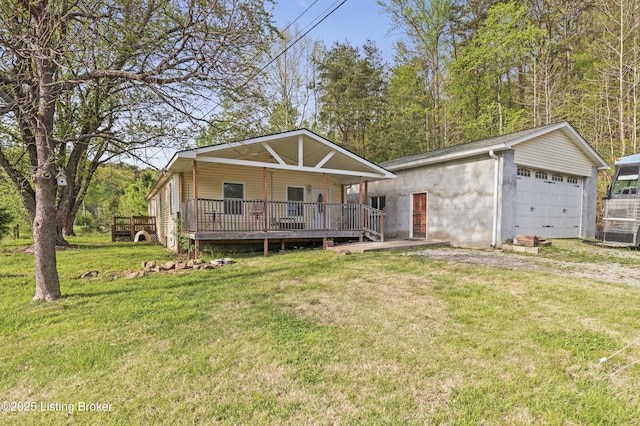 1782 Happy Hollow Rd, Clermont, KY 40110 - view of front of home with a garage, a front yard, a deck, and an outbuilding