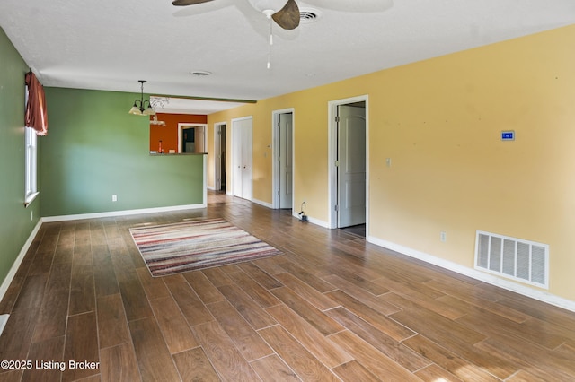 1782 Happy Hollow Rd, Clermont, KY 40110 - empty room featuring wood finished floors, baseboards, ceiling fan, and a chandelier
