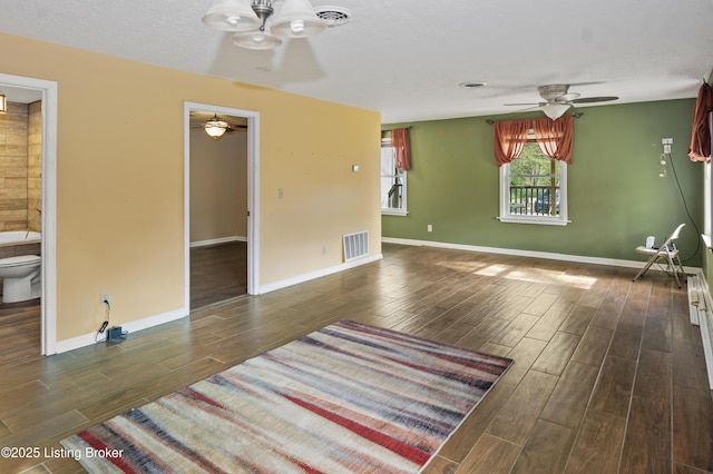1782 Happy Hollow Rd, Clermont, KY 40110 - unfurnished living room with ceiling fan, wood tiled floors, and baseboards