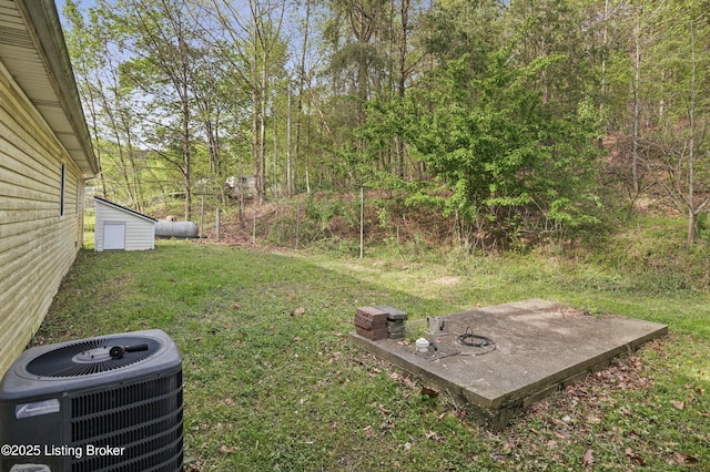 1782 Happy Hollow Rd, Clermont, KY 40110 - view of green lawn featuring central AC unit, an outbuilding, and a shed