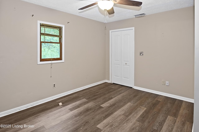 1782 Happy Hollow Rd, Clermont, KY 40110 - spare room with wood finished floors, ceiling fan, baseboards, and a textured ceiling