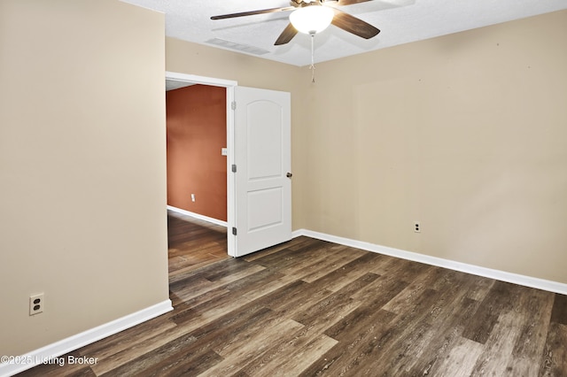 1782 Happy Hollow Rd, Clermont, KY 40110 - empty room featuring ceiling fan, baseboards, dark wood-type flooring, and a textured ceiling