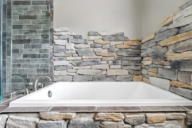 full bathroom with a bath