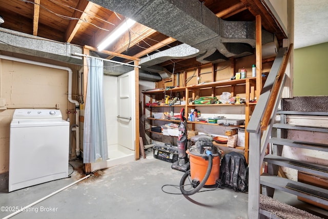 unfinished below grade area featuring washer / dryer