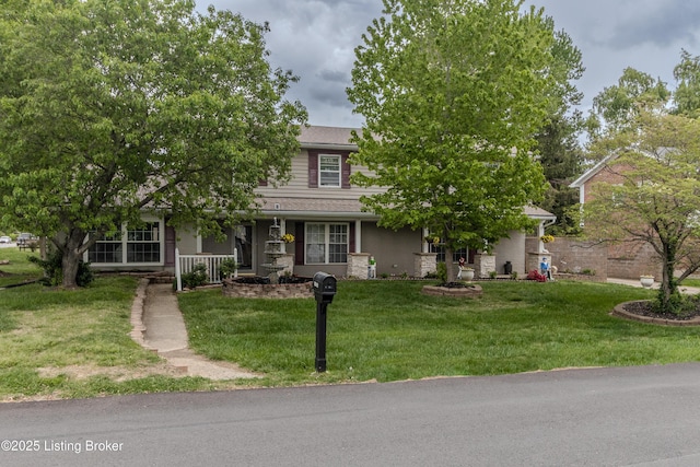 obstructed view of property featuring a front lawn