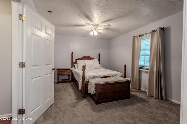 carpeted bedroom featuring a textured ceiling, a ceiling fan, and baseboards