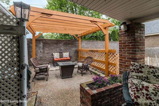 view of patio with outdoor lounge area, fence, and a pergola