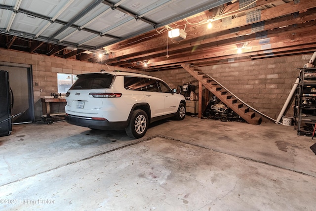 garage with concrete block wall