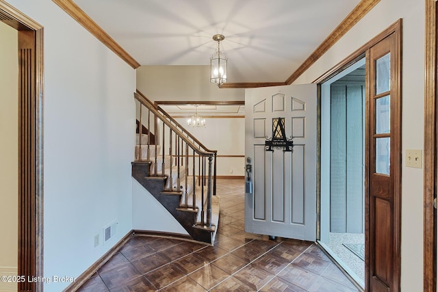 foyer entrance with an inviting chandelier, stairs, visible vents, baseboards, and ornamental molding