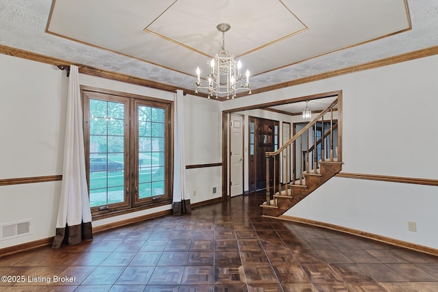 unfurnished room with stairway, visible vents, a notable chandelier, and baseboards