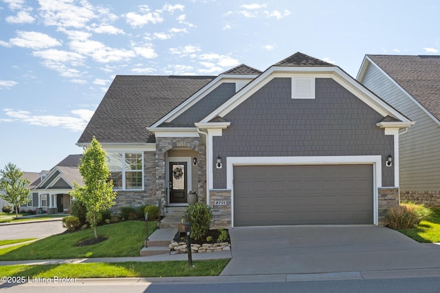 craftsman inspired home with driveway, a shingled roof, stone siding, and a garage