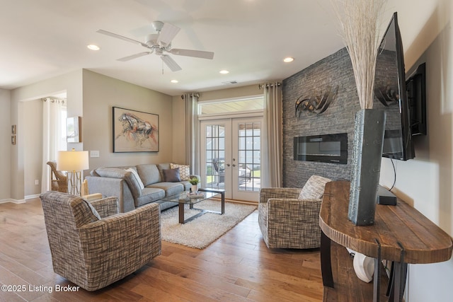 living area with ceiling fan, french doors, hardwood / wood-style floors, recessed lighting, and visible vents