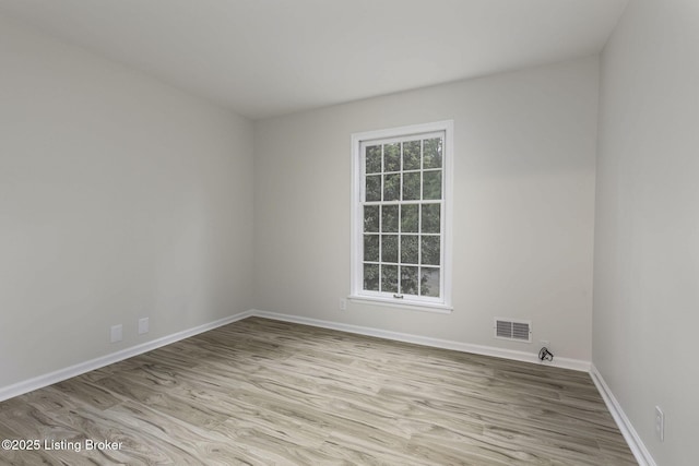 6505 Deep Creek Dr Unit 3, Prospect, KY 40059 - empty room with baseboards, visible vents, and wood finished floors