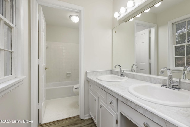 6505 Deep Creek Dr Unit 3, Prospect, KY 40059 - bathroom featuring a sink, toilet, double vanity, and wood finished floors