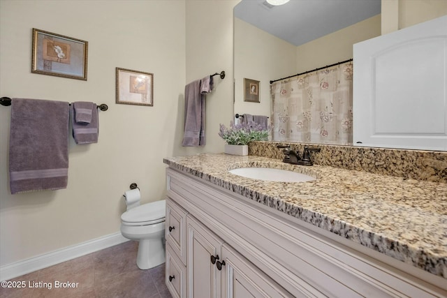 bathroom with tile patterned floors, toilet, vanity, a shower with curtain, and baseboards