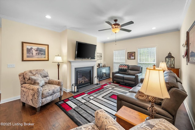 living area featuring hardwood / wood-style flooring, a fireplace with flush hearth, a ceiling fan, and recessed lighting