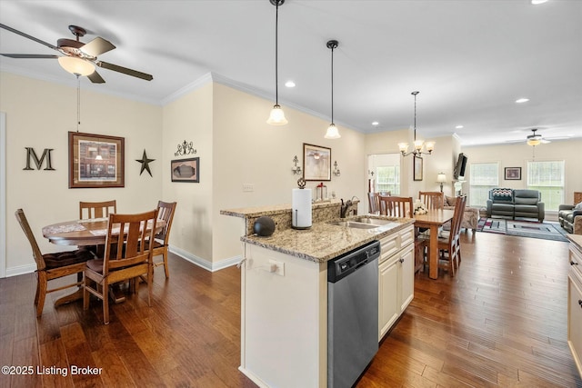 kitchen featuring dishwasher, a sink, light stone countertops, dark wood-style flooring, and ceiling fan with notable chandelier