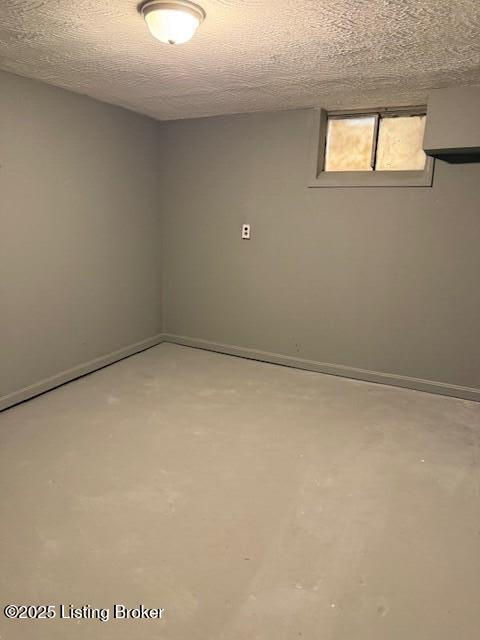 610 Compton St, Louisville, KY 40208 - below grade area with a textured ceiling and baseboards