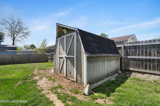 view of shed with a fenced backyard