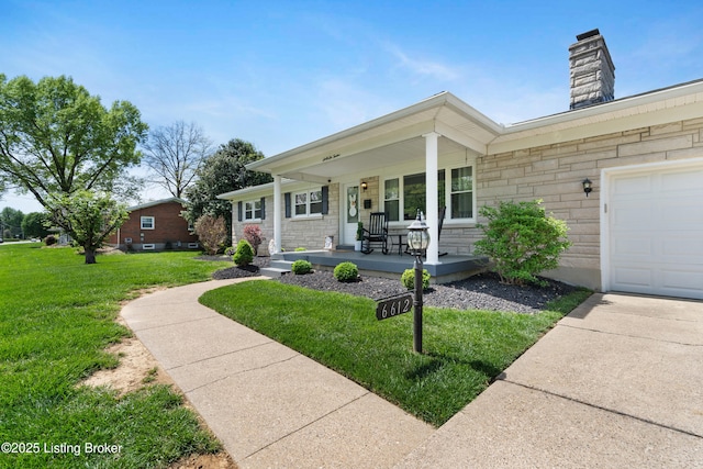 view of front facade featuring stone siding, a front lawn, covered porch, and a chimney