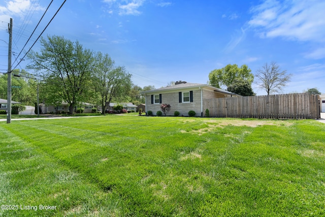 view of yard with fence